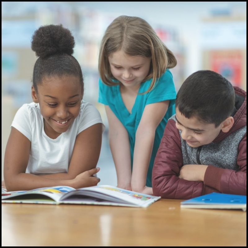 First graders reading a book together for readers theater fluency practice